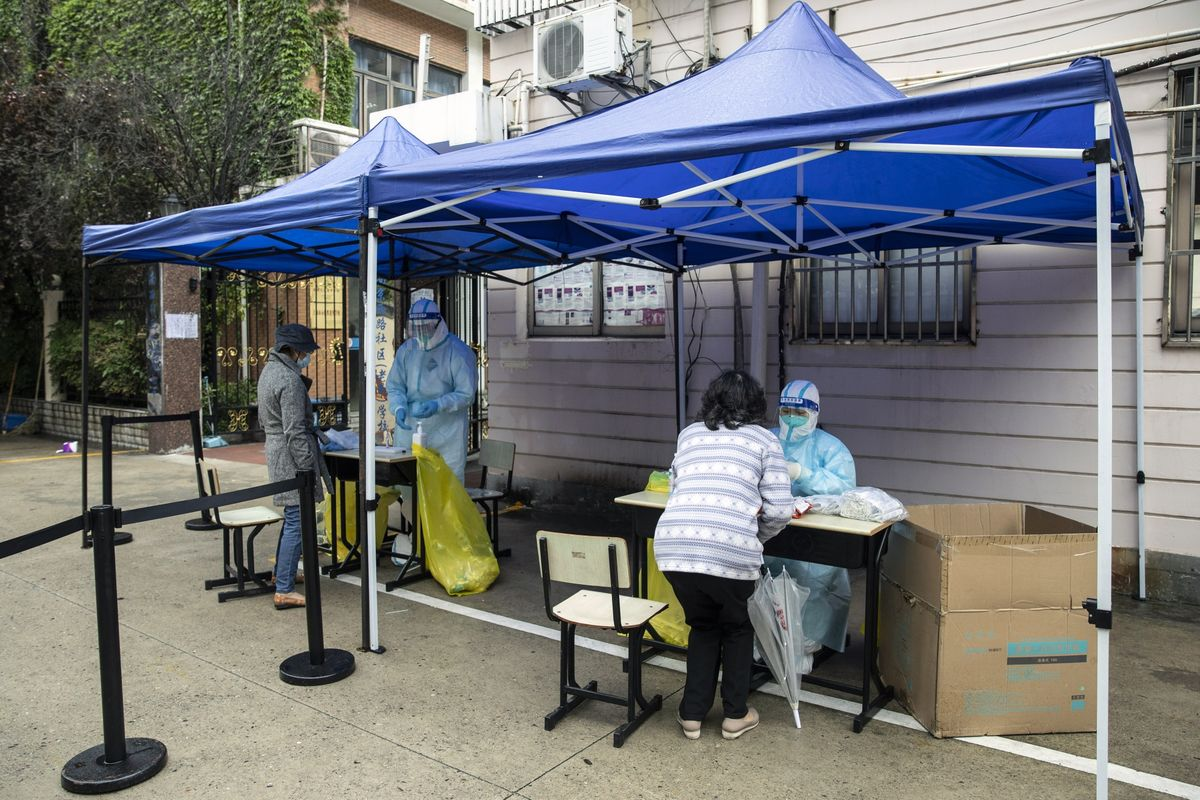 Residents take part in a round of Covid-19 testing during a lockdown in Shanghai on April 14.