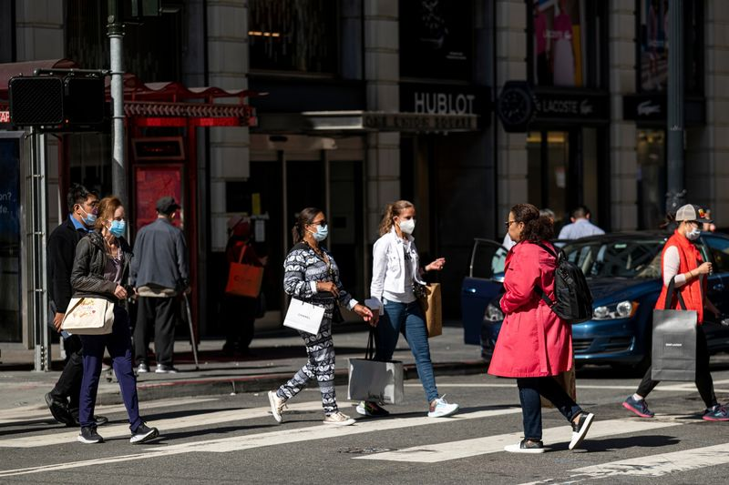 Pedestrians carry shopping bags in San Francisco, California, US.