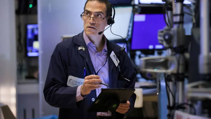 A trader works on the trading floor at the New York Stock Exchange (NYSE) in Manhattan, New York City, U.S., August 3, 2022. REUTERS/Andrew Kelly