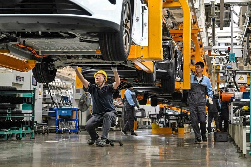 China industrial profits slide as demand weakens | The Straits Times