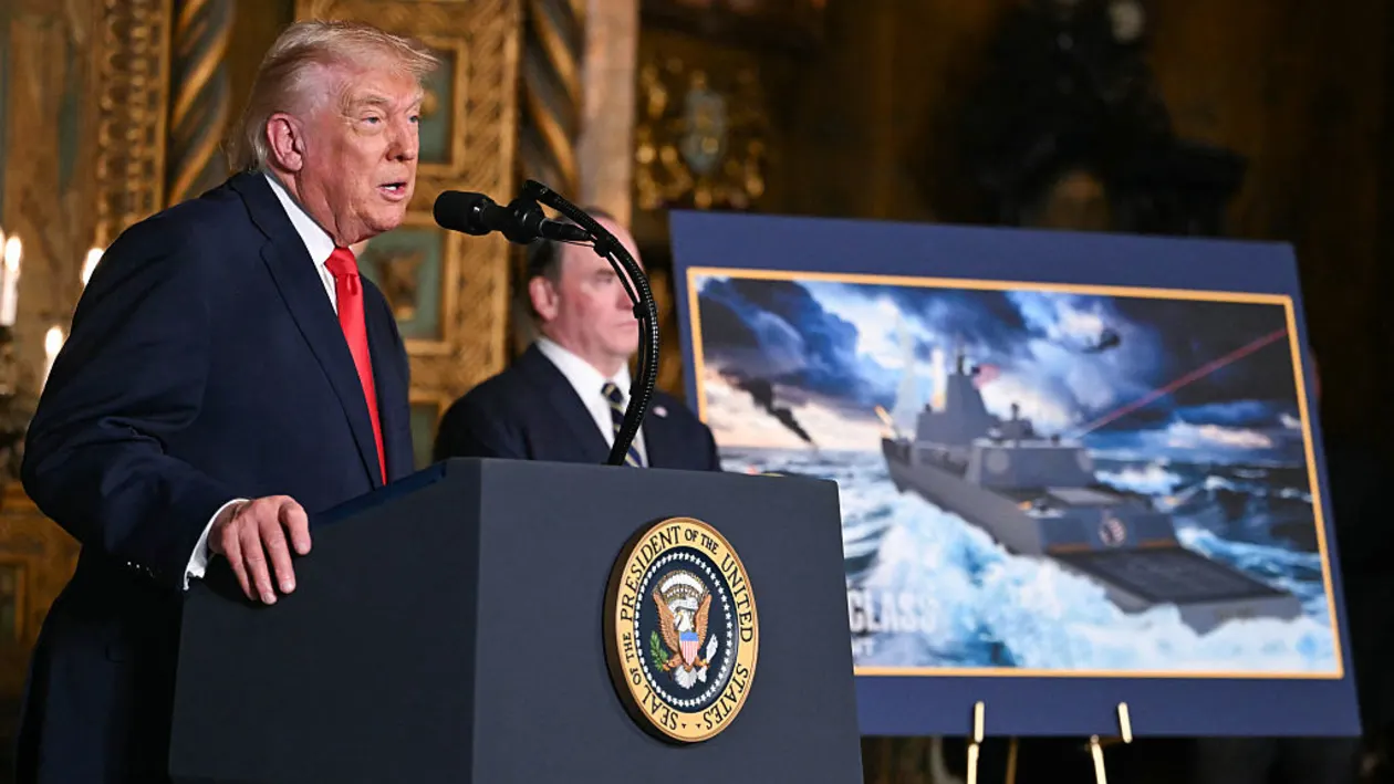 US President Donald Trump, flanked by Navy Secretary John Phelan (R), announces the US Navy's new Golden Fleet initiative, unveiling a new class of frigates, at Mar-a-Lago in Palm Beach, Florida, on December 22, 2025. (Photo by ANDREW CABALLERO-REYNOLDS / AFP via Getty Images)